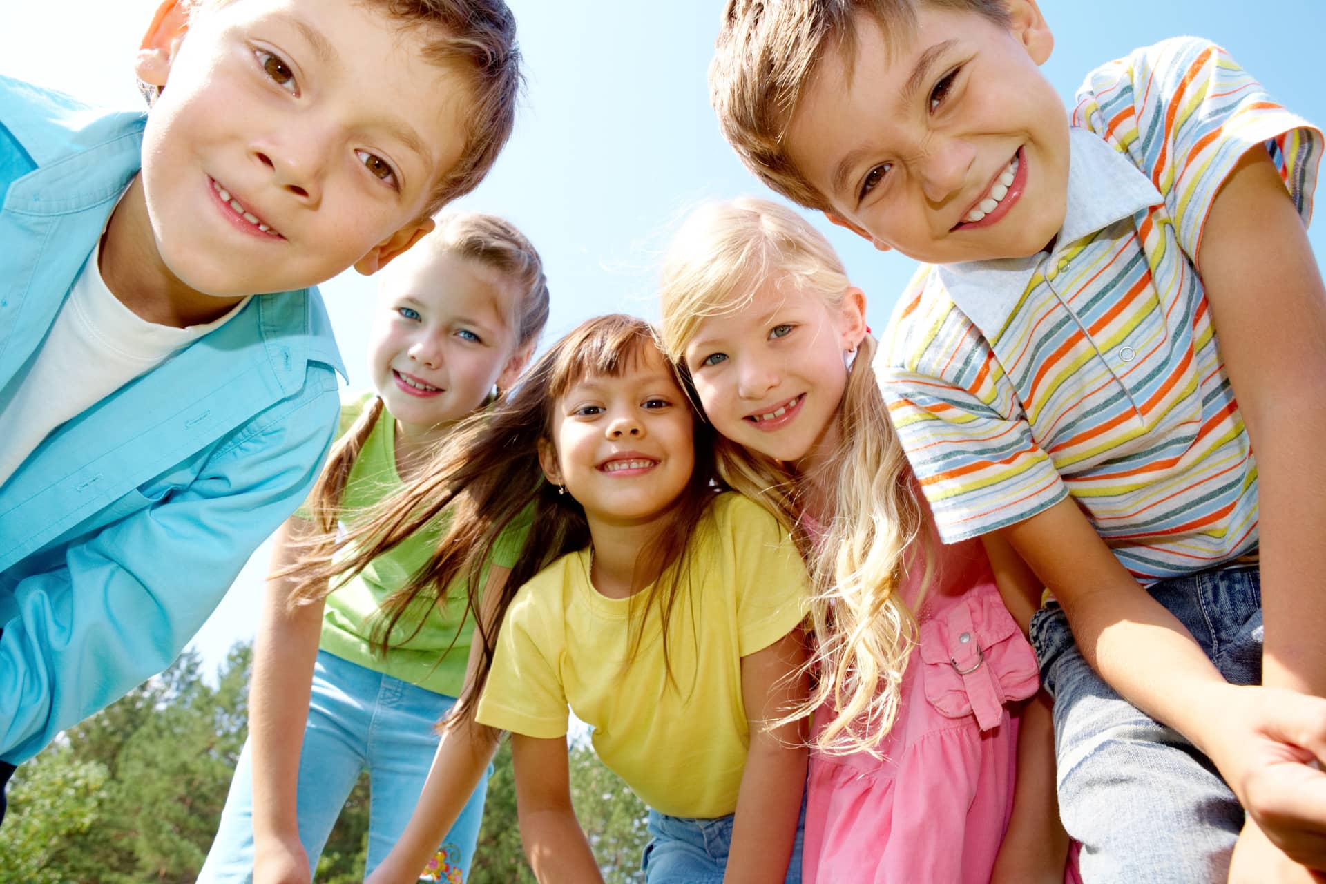 Portrait of happy kids looking at camera