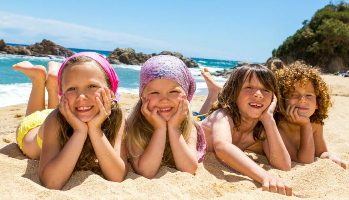 Kids laying on the beach