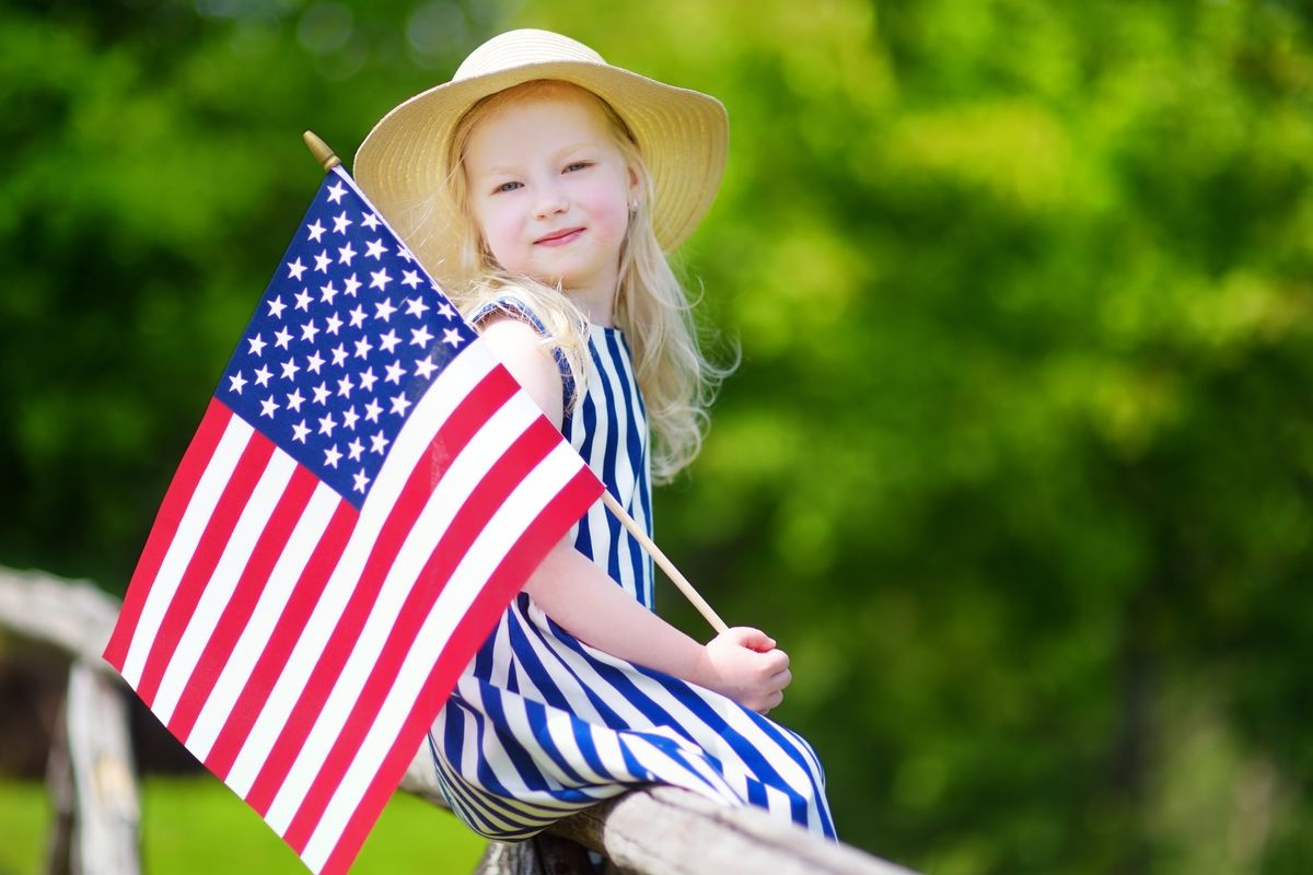 Cute little girl holding American flag Cute little girl holding American flag