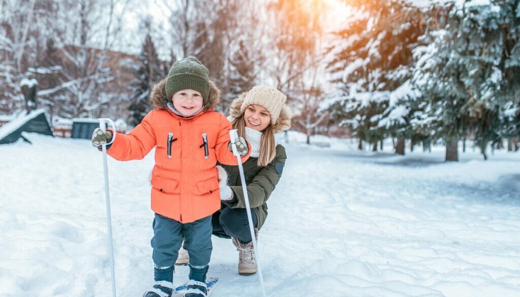 Mom and child happy smiling in winter