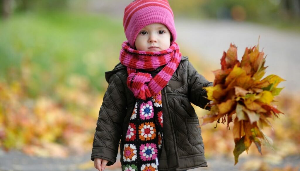 Daycare baby in an autumn park